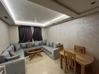 a living room with a couch and a table at Zahira New Luxury Near The Beach - Entire Apartment in Casablanca