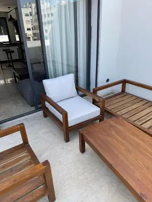 a room with benches and a chair and a table at chic escape in Casablanca