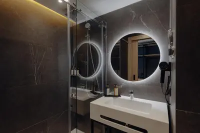 a bathroom with a sink and a mirror at Exe Casablanca in Casablanca