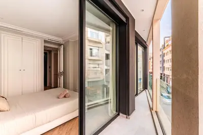 a glass room with a bed and a window at Le Claridge - Cosy Studio - By Mi-Haven in Casablanca
