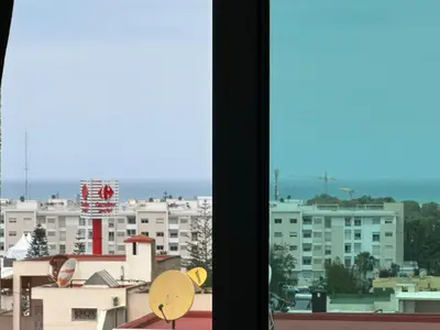 a view of a city from a window at Wifaq temara in Temara