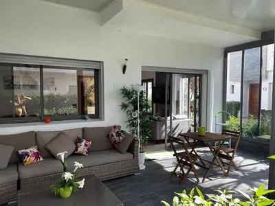 a living room with a couch and a table at Villa Blanca - by Nero in Sidi Rahal