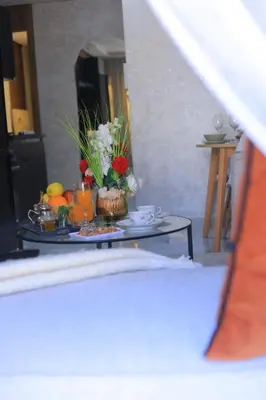 a table with a tray of flowers on it at Charmant studio au cœur de Maarif - Confort balcon et emplacement idéal in Casablanca