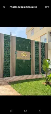 a building with a sign on the side of it at appartement de lux vue piscine 5 min plage bouznika in Bouznika