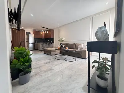 a living room with a couch and a table at Central Maarif Studio in Casablanca