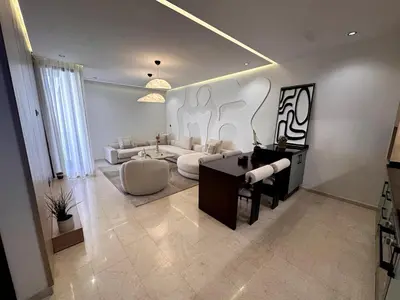 a living room with a couch and a table at Comfortable & Central Casablanca Apartment in Casablanca