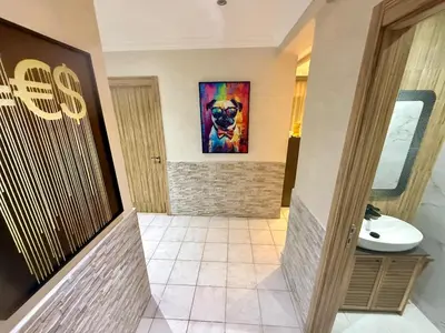 a bathroom with a painting of a dog on the wall at Apartment Majorelle Garden in Casablanca