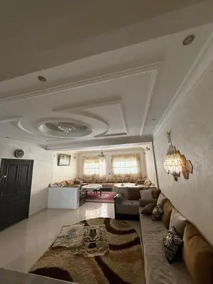 a large living room with a couch and a living room at Appartement central familial avec grande terrasse in Casablanca