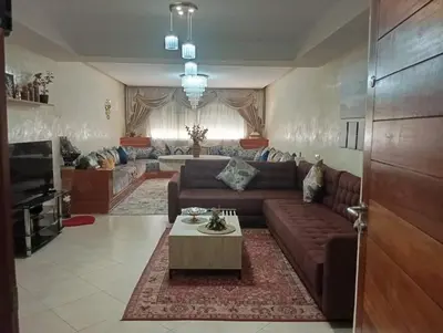 a living room with a couch and a table at Elegant apartment in Rabat in Rabat