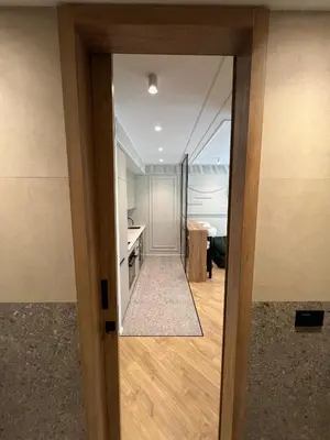 a door leading into a room with a kitchen at Appartement Le Claridge in Casablanca