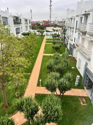 an aerial view of a courtyard of a building with trees at Appartament Melrose beach dar bouazza in Tamaris