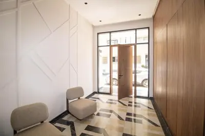 a waiting room with two chairs and a door at Comfort & Premium in Casablanca