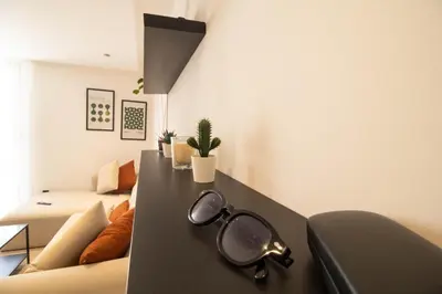 a pair of glasses sitting on a table in a living room at Comfort & Premium in Casablanca