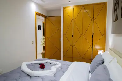 a bedroom with a bed with a large door at R106- Amazing & Colourful Apartment near High Speed Train Station in Casablanca