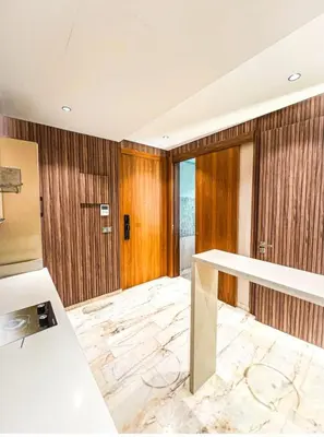 a large room with a marble floor and wooden walls at Studio luxueux in Casablanca