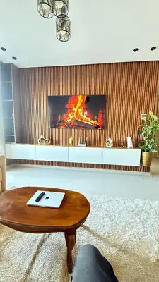 a living room with a coffee table and a fireplace at luxury apartement en el mansouria in Pont Blondin