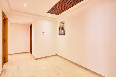 an empty room with a painting on a white wall at Casablanca 3 Bed Unit in Triangle Dor With Parking in Casablanca