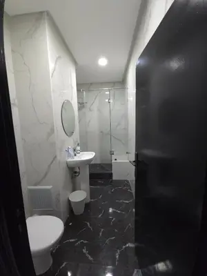 a bathroom with a toilet and a sink and a shower at Havre de paix en plein coeur de Casa in Casablanca