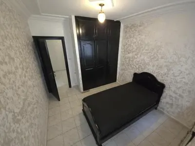 a room with a black bed and a black door at Havre de paix en plein coeur de Casa in Casablanca