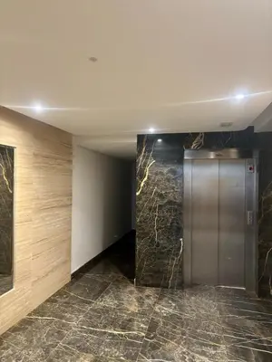 a elevator in a building with a marble floor at Studio cosy in Casablanca