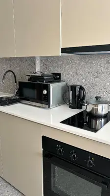 a microwave oven sitting on a kitchen counter at HBkf Residence in Casablanca