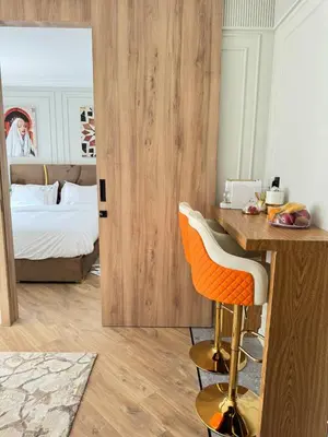 a bedroom with a bed and a desk with a deskngthngthngthngthngth at HBkf Residence in Casablanca