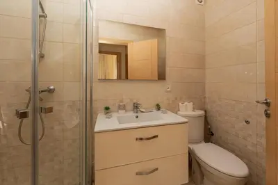 a bathroom with a toilet and a sink and a shower at Welcome Sidi Rehal Escape King Bed Res Casabay in Sidi Rahal