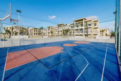 a basketball court in front of a apartment building at Welcome Sidi Rehal Escape King Bed Res Casabay in Sidi Rahal