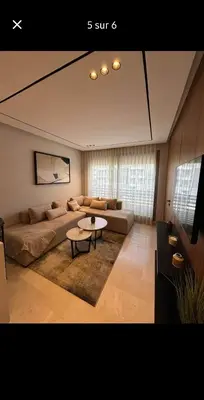 a living room with a couch and a table at LA Princesse 12th in Casablanca