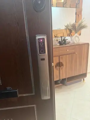 an open door with a control panel in a kitchen at Comfortable and quiet apartment with Buzzinga in Bouznika