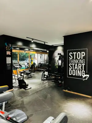 a gym with a sign that says stop thinking start doing at Rafina in Casablanca