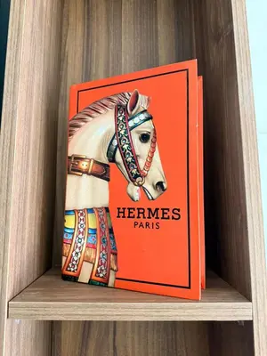 a book on a shelf with a picture of a horse at Studio Al Mahdi 23 CFC 2 minutes away in Casablanca