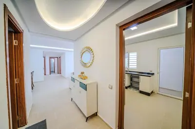 a large white room with a large ceiling at Rabat Apartment in Rabat