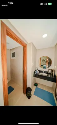 a bathroom with a sink and a mirror at Rabat Apartment in Rabat