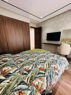 a bedroom with a large bed with a colorful blanket at Studio New York 1 CFC 2 minutes away in Casablanca