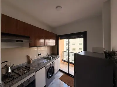 a kitchen with a sink and a stove top oven at Urban Loft - by Nero in Casablanca
