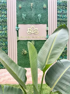 a sign for the garden paradise at the garden paradise hotel at Residence Garden Paradise plage luxe in Bouznika