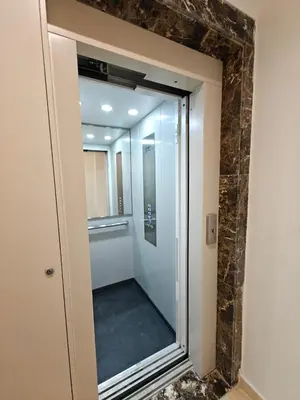 a glass door to a walk in shower in a room at L'Écume Des Sablettes in Mohammedia