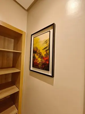 a painting hanging on a wall in a room at L'Écume des Sablettes in Mansouria
