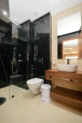a bathroom with a toilet and a sink and a shower at Antonio Cerezo in Maarif