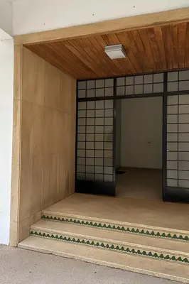 an entrance to a building with a gate and a wall at Appartement de luxe 2 chambres PS5,AC,Fibre,Netflix à agdal Au coeur de Rabat in Rabat