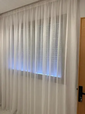 a window with white curtains in a room at Chic Studio In The Heart of Casablanca Morocco in Casablanca