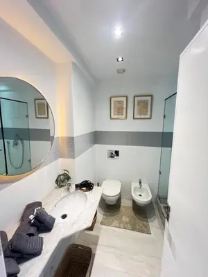 a bathroom with a sink and a toilet and a mirror at Stay In GAUTHIER studio K in Casablanca
