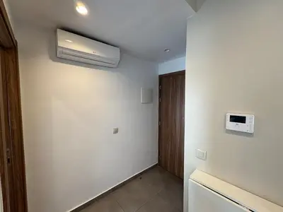 a room with a white wall with a air conditioner at Studio en plein centre de Gautier in Casablanca