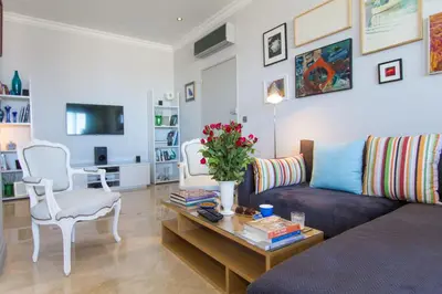 a living room with a couch and a coffee table at Appartement Lilia in Casablanca