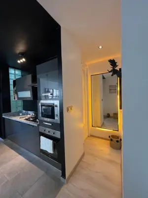 a kitchen with a sink and a microwave at Stay IN GAUTHIER studio M in Casablanca