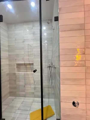 a shower with a glass door in a bathroom at Stay IN GAUTHIER studio M in Casablanca