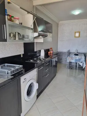 a kitchen with a washing machine and a dishwasher at appartement central in Casablanca