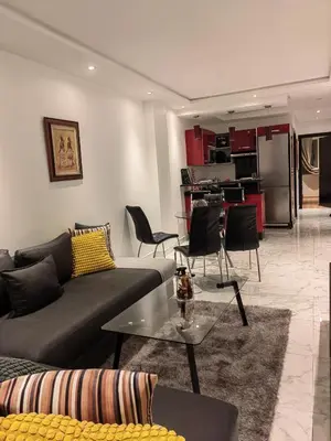 a living room with a couch and a table at studio casa in Casablanca