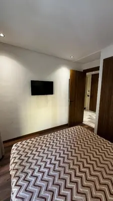 a bedroom with a large bed and a flat screen tv at Luxurious Studio in Casablanca in Casablanca